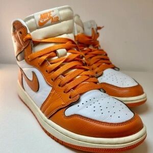 Nike Air Jordans high-tops with orange and white design